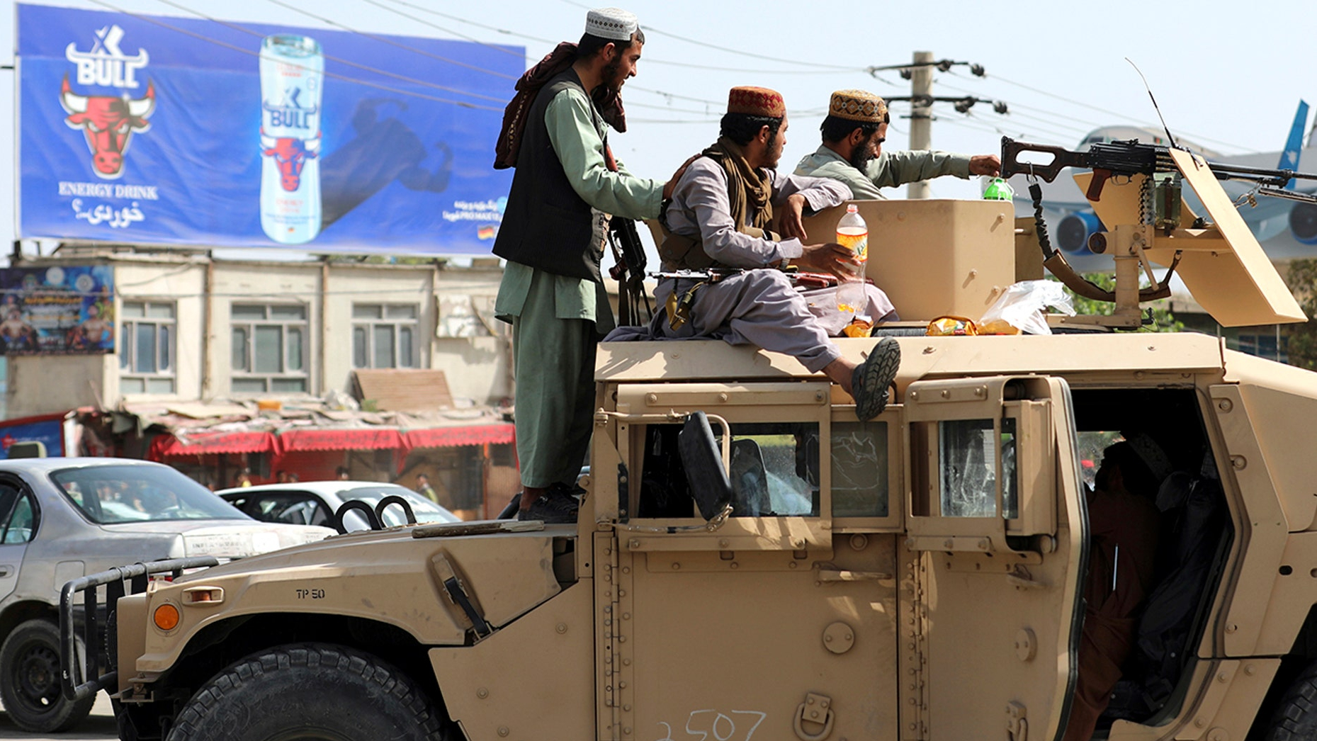 Taliban Aboard Government HMMWV in Kabul