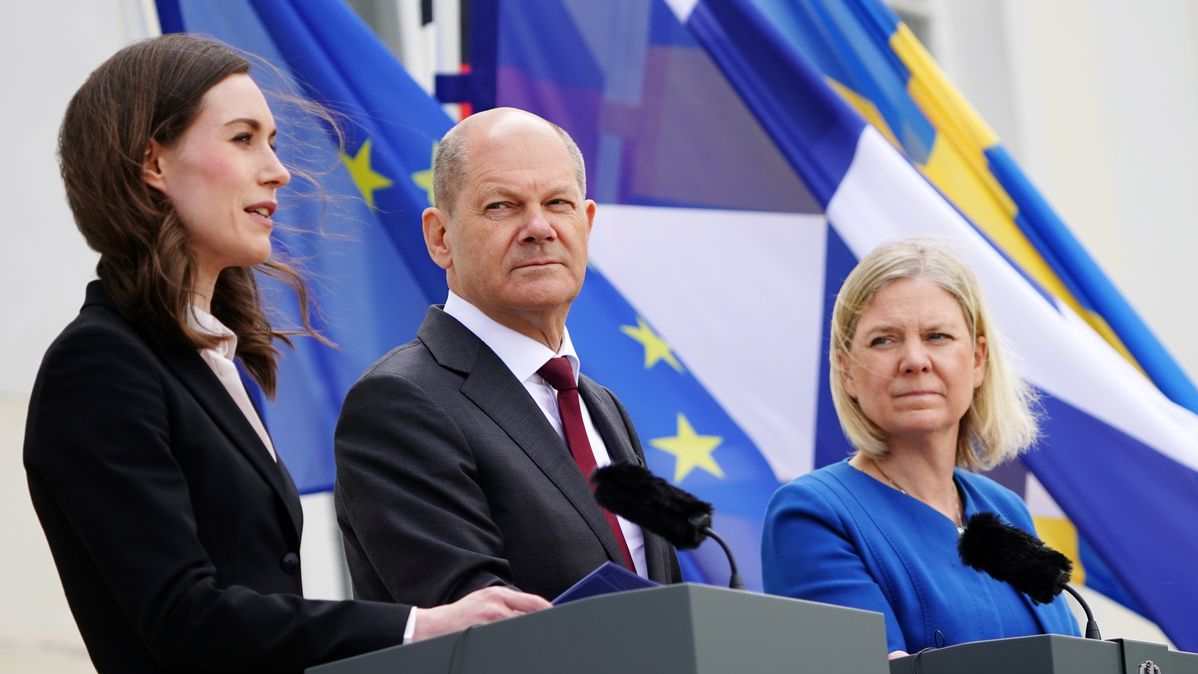 Finnish Prime Minister Sanna Marin, German Chancellor Olaf Scholz, and Swedish Prime Minister Magdalena Andersson address the media