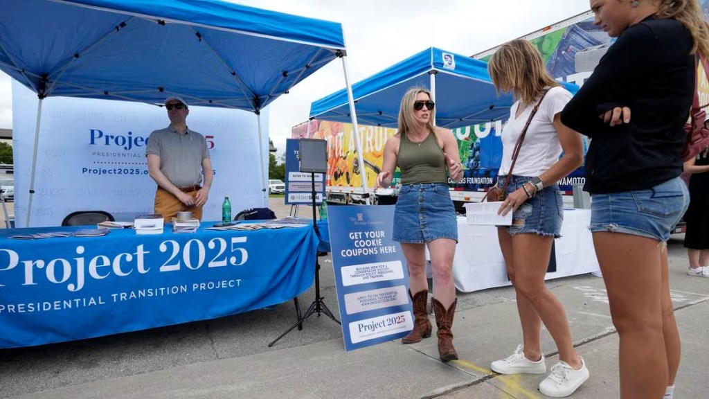 Supporters of Project 2025 talk with attendees of Iowa State Fair in August